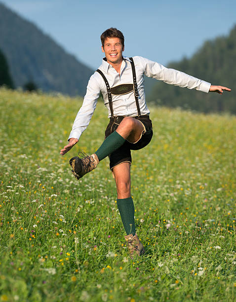A high-quality photo of a model wearing MrLederhosen’s best-selling Lederhosen, paired with suspenders and a confident smile