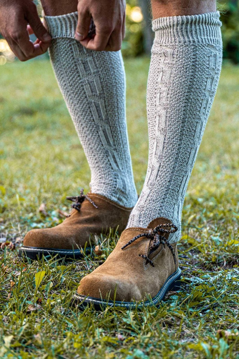a carousel of your bestsellers: Women Lederhosen, Bavarian Socks, and a Mens Bavarian Shoes close-up.