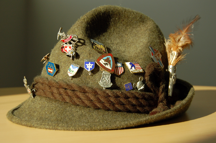 a flat-lay of accessories: Tyrolean hat, Bavarian Socks, leather bag, and a pewter belt buckle. Add a caption: “Details Make the Outfit.
